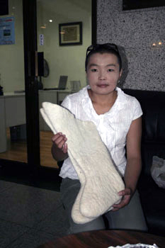 Lady showing thick Mongolian boot linings