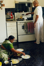 Members of Patel family cooking at home