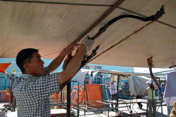 Picture of man handling bows - taken at Ulaan Baatar's flea market